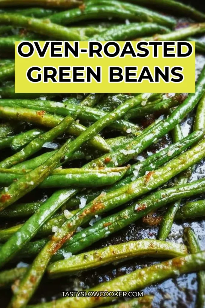Oven-roasted green beans served on a plate with seasoning.