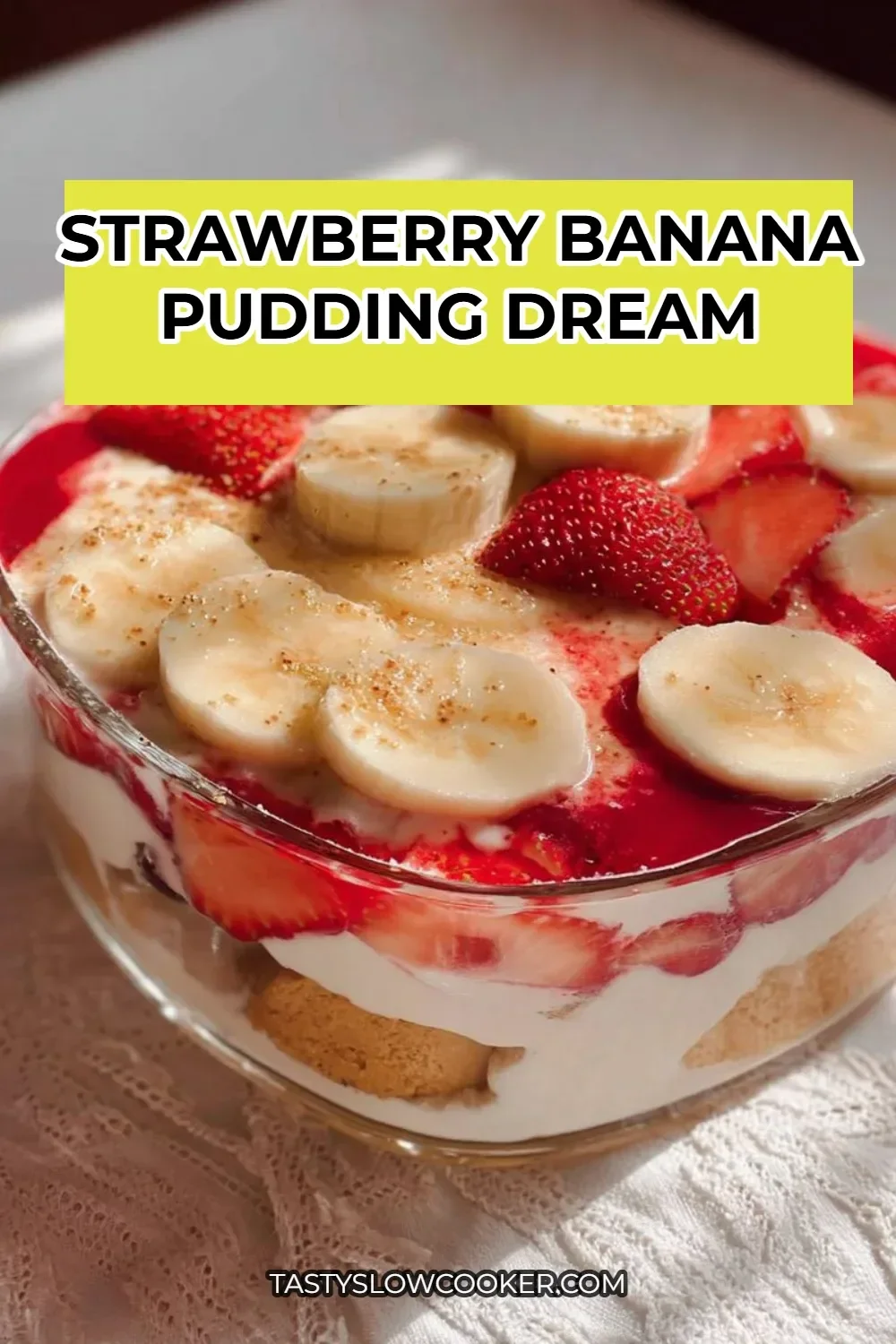 Delicious bowl of strawberry banana pudding topped with fresh fruit and whipped cream