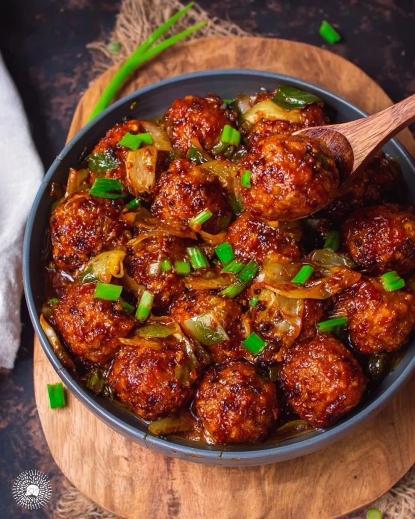Delicious Cabbage Manchurian served in a bowl with garnish.