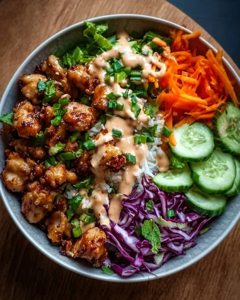 Delicious Bang Bang Chicken Bowl served with fresh ingredients and sauce