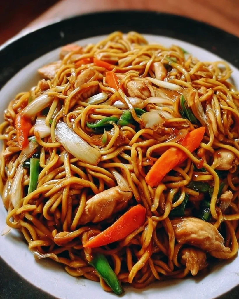 Plate of Chicken Lo Mein with vegetables and noodles