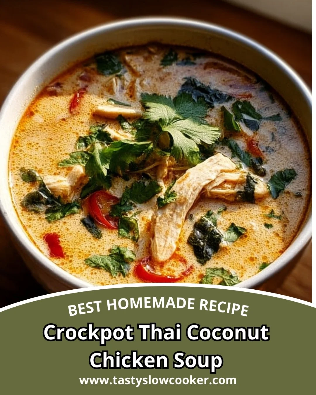 Bowl of Crockpot Thai Coconut Chicken Soup garnished with fresh herbs