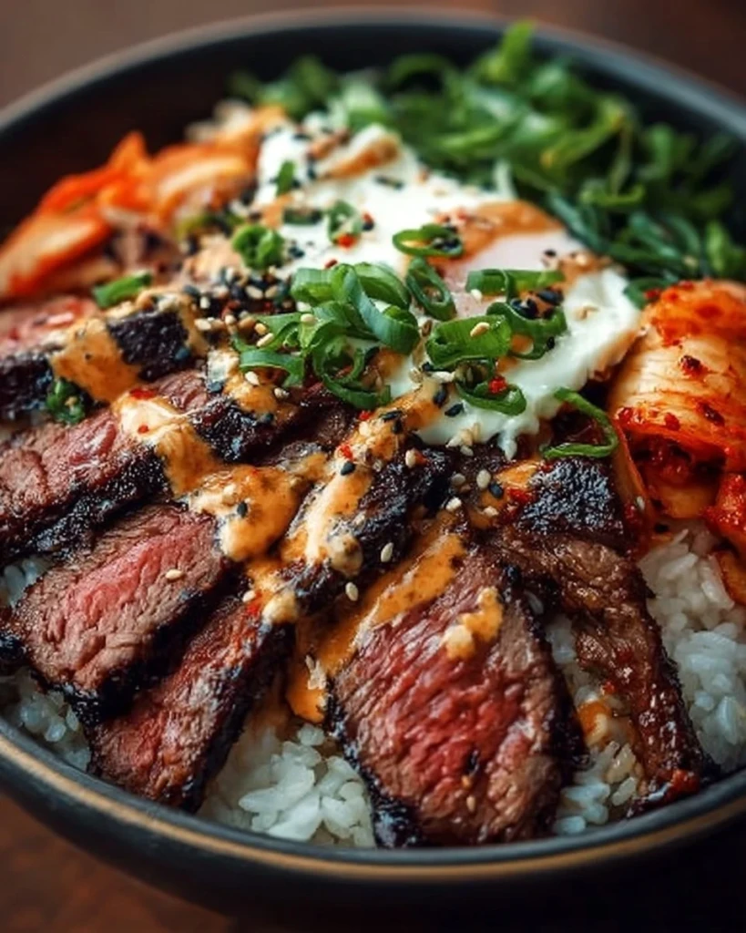 Korean BBQ steak rice bowl with vibrant vegetables and spices