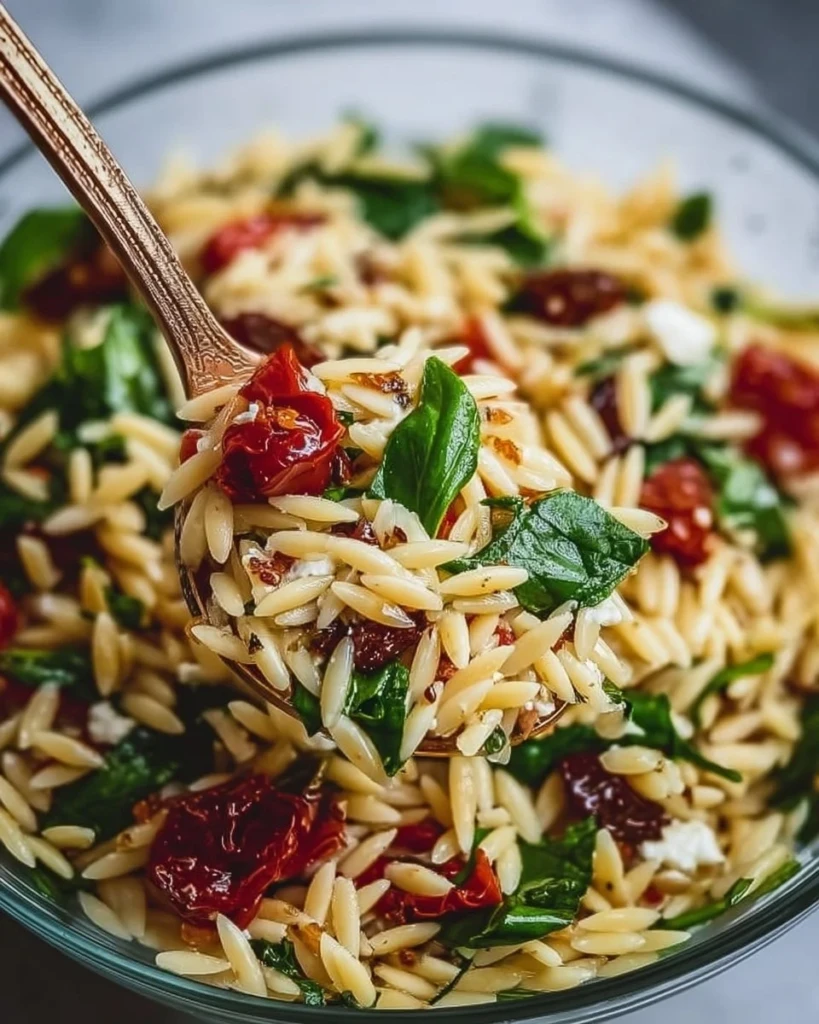 Delicious classic balsamic orzo salad with fresh vegetables and herbs