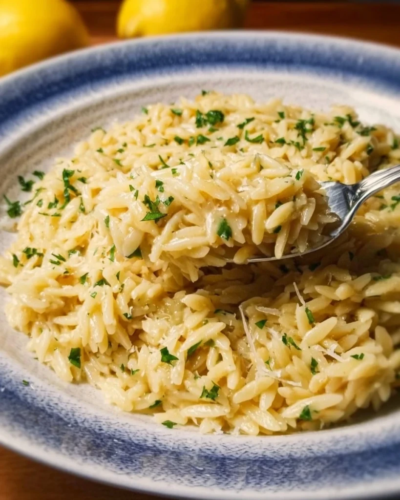 Creamy Lemon Parmesan Orzo dish garnished with parsley on a plate