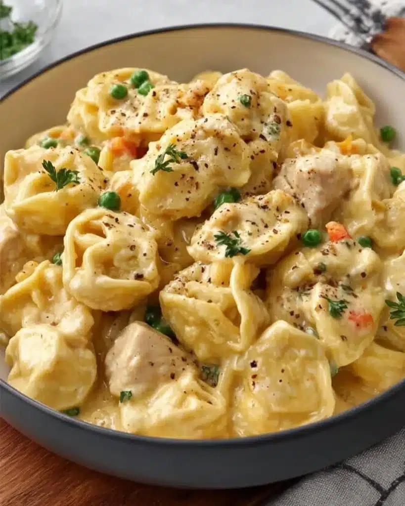 Crockpot Cheddar Chicken Pot Pie Tortellini served in a cozy bowl