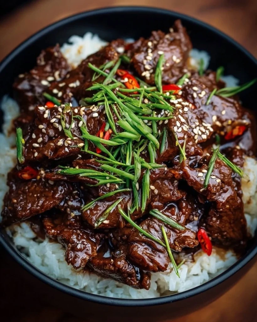 Delicious Easy Slow Cooker Korean Beef ready to serve in a bowl.