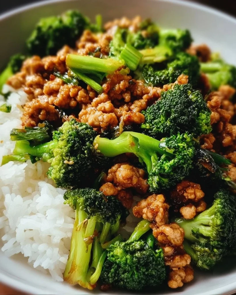 Ground chicken broccoli stir fry prepared with vegetables and served in a bowl